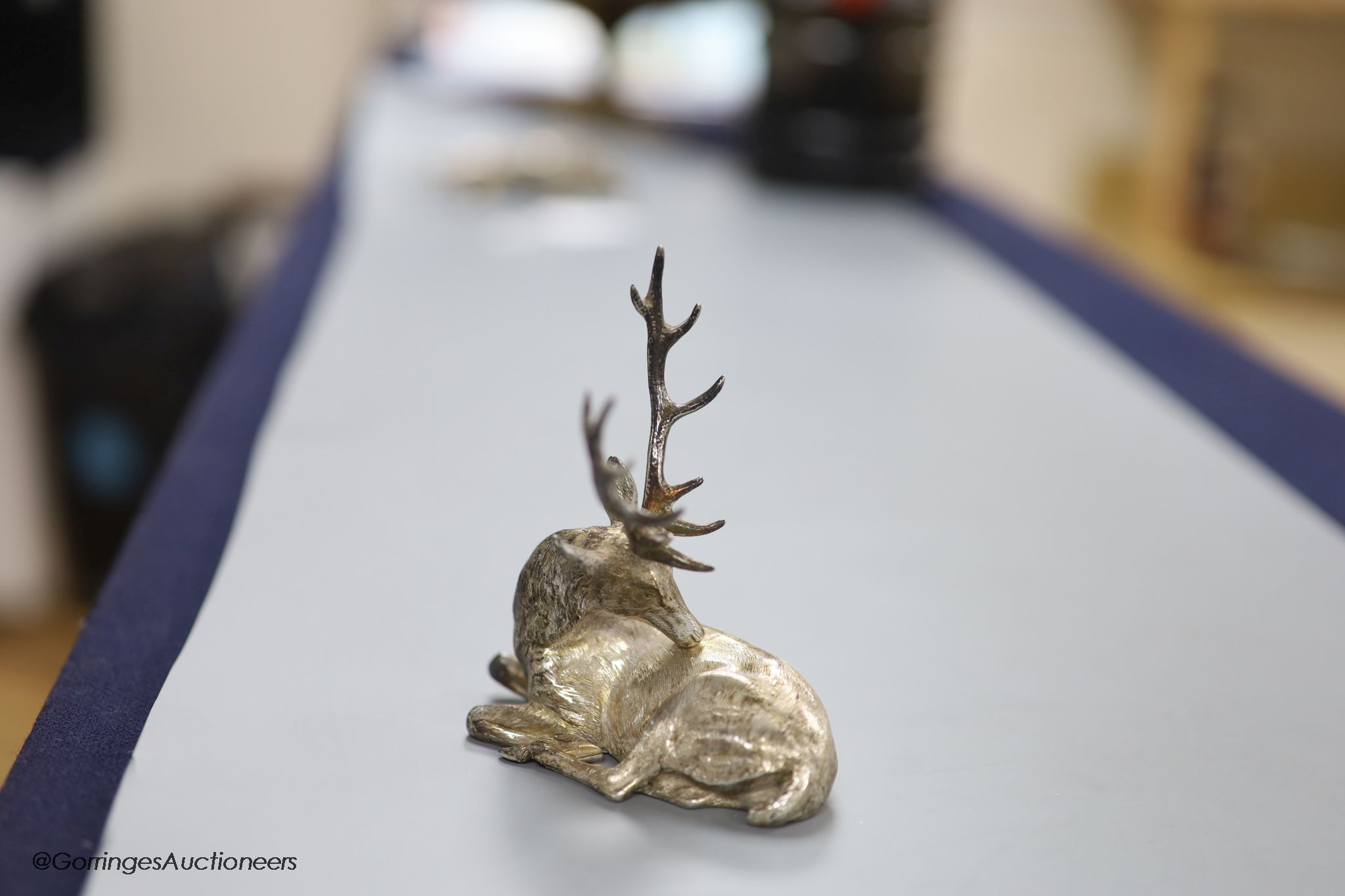 A modern silver miniature model of a recumbent stag C.F.H & Co, London, 1994, height 10.6cm, 170 grams.